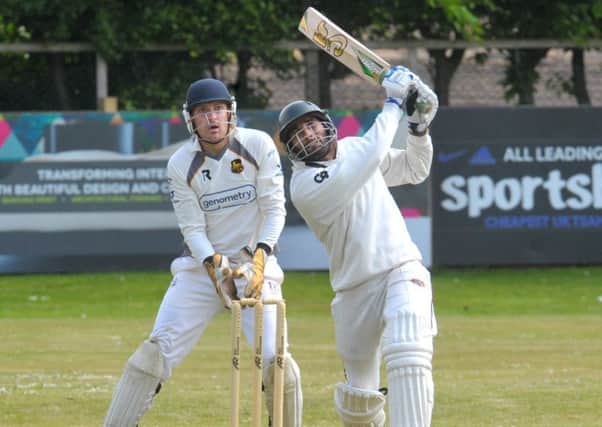 Clearing the ropes: Townville's Shahid Nawaz struck two sixes out of the ground for Townville before bowled by Pudsey St Lawrnece's Chris Marsden. Picture: Steve Riding