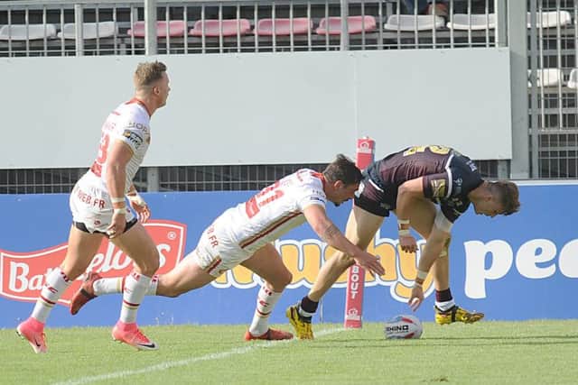 Try: Ashley Handley touches down for the Rhinos in France.