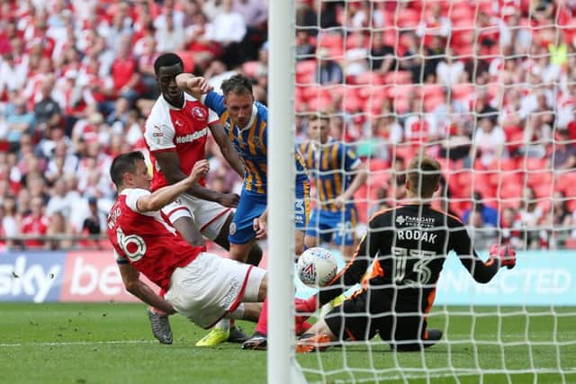 Alex Rodman of Shrewsbury Town shoots to score his sides equalising goal in the 58th minute to make it 1-1 past Richard Wood and goalkeeper Marek Rodak of Rotherham United (Picture: John Patrick Fletcher/Action Plus via Getty Images)