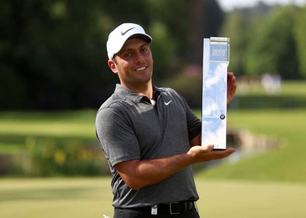 Italy's Francesco Molinari poses with the trophy after winning the 2018 BMW PGA Championship at Wentworth.