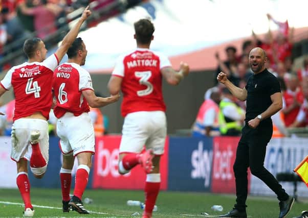 Rotherham United's Richard Wood (6) celebrates scoring his side's second goal of the game with Rotherham United manager Paul Warne (right) (Picture: PA)