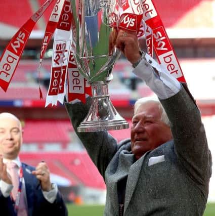 Rotherham United chairman Tony Stewart with the trophy (Picture: PA)