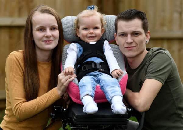 The mother of a 20-month-old toddler from Fitzwilliam, who has limited use of her arms and legs  has launched a Â£20,000 fundraising drive to take her for specialist treatment in Panama. Imogen Holmes was diagnosed with spastic quadriplegic cerebral palsy at Pinderfields Hospital in June 2017. Imogens mother Briony Winstanley has started a Â£20,000 fundraising drive to to pay for stem cell treatment for Imogen in Panama in central America. Imogen pictured with her parents Briony Winstanley and Stephen Holmes.
9th March 2018.
Picture Jonathan Gawthorpe