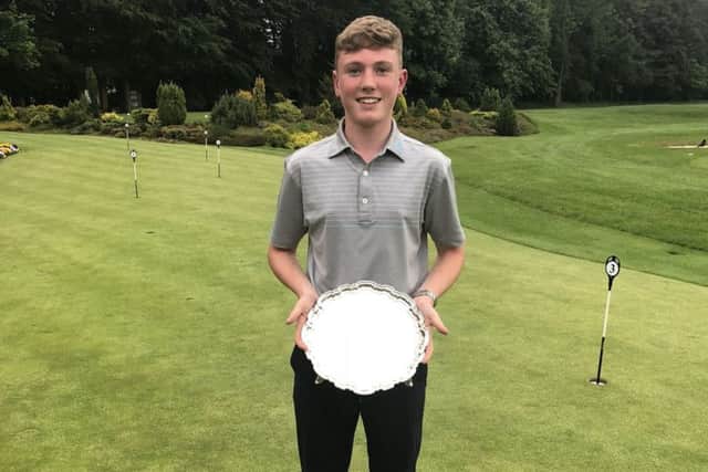Rotherham's Ben Schmidt with the trophy after winning the Yorkshire Boys' championship at Malton & Norton.