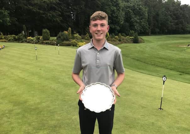 Rotherham's Ben Schmidt with the trophy after winning the Yorkshire Boys' championship at Malton & Norton.