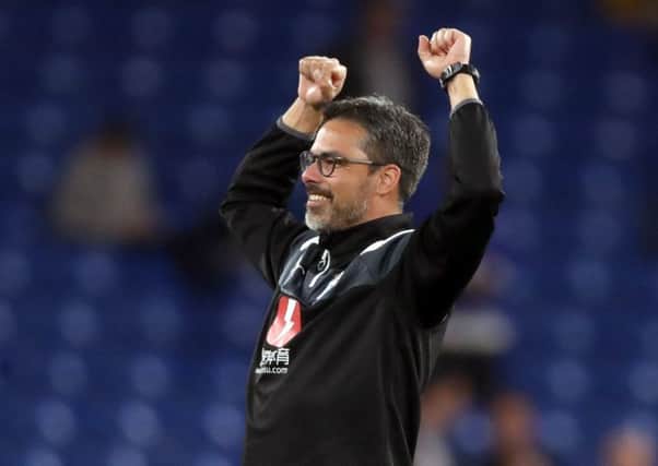 Huddersfield Town manager David Wagner celebrates after the point at Stamford Bridge against Chelsea secured Town's Premier League status (Picture: PA)