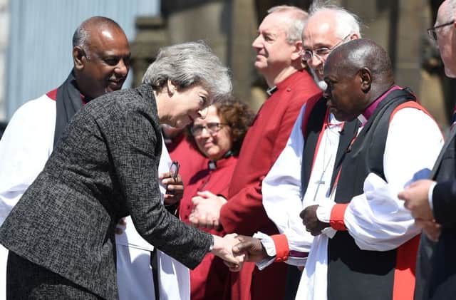 The Archbishop of York greets Theresa May at last week's Manchester memorial service.
