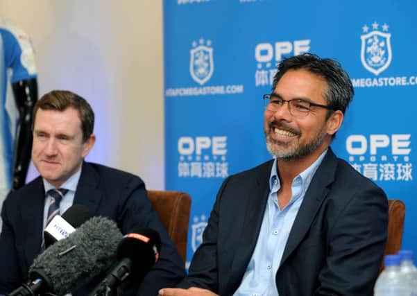 Huddersfield Town head coach David Wagner signs a new deal at the newly promoted team. Pictured with chairman Dean Hoyle. (Picture: Jonathan Gawthorpe)